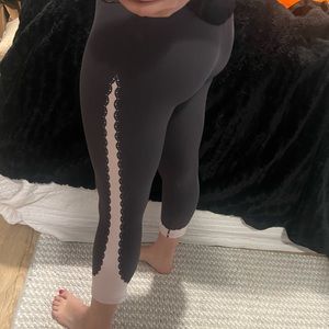 Athleta leggings. Gray/purple color with light pink “lace” detail down sides.